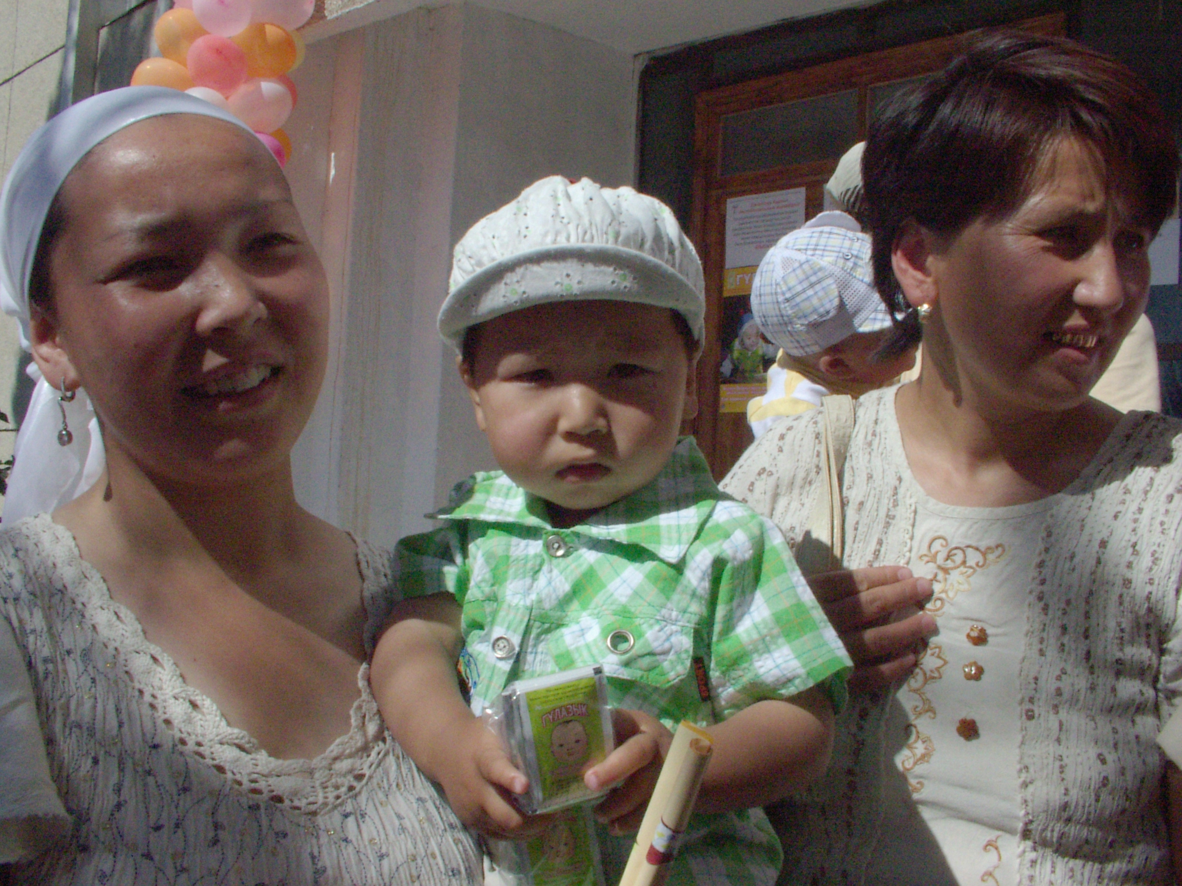 Baby Barsbek and his mother at a clinic