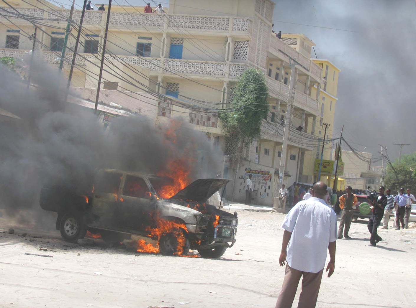 A government car is set ablaze in Hargeisa, capital of the secessionist territory of Somaliland, on 12 September as opposition supporters and civil service activists protested the closure of the lower house of representatives