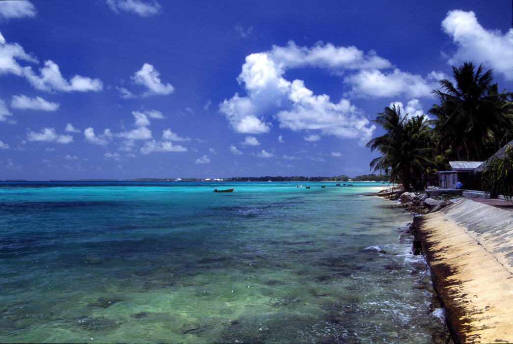 A beach at Funafuti atoll, capital of Tuvalu, a Polynesian island nation located in the Pacific Ocean, midway between Hawaii and Australia. With a population of less than 12,000, Tuvalu is likely to disappear in the future because of rising sea levels