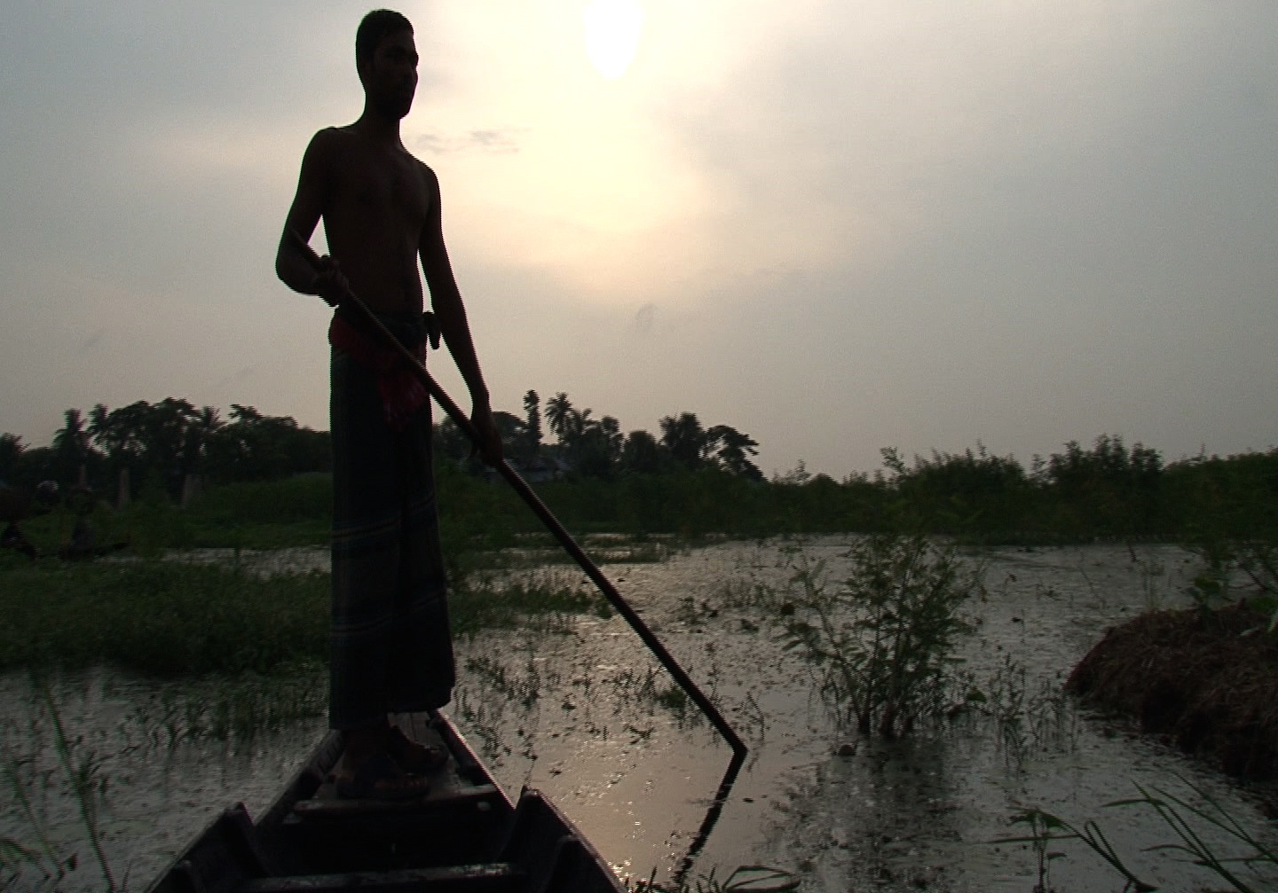 Sujit Kumar Mondal sailing to his floating garden