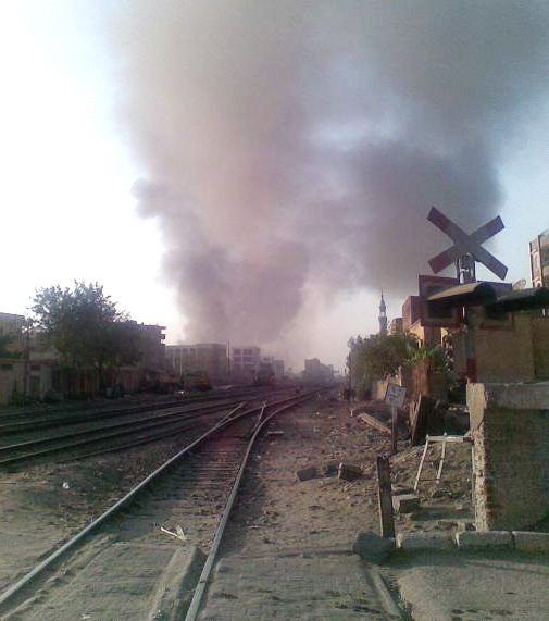 Smoke rises from the early morning burning of rice straw on a farm in Qalyubia Governorate. The smoke will drift to the city and add to Cairo’s black cloud