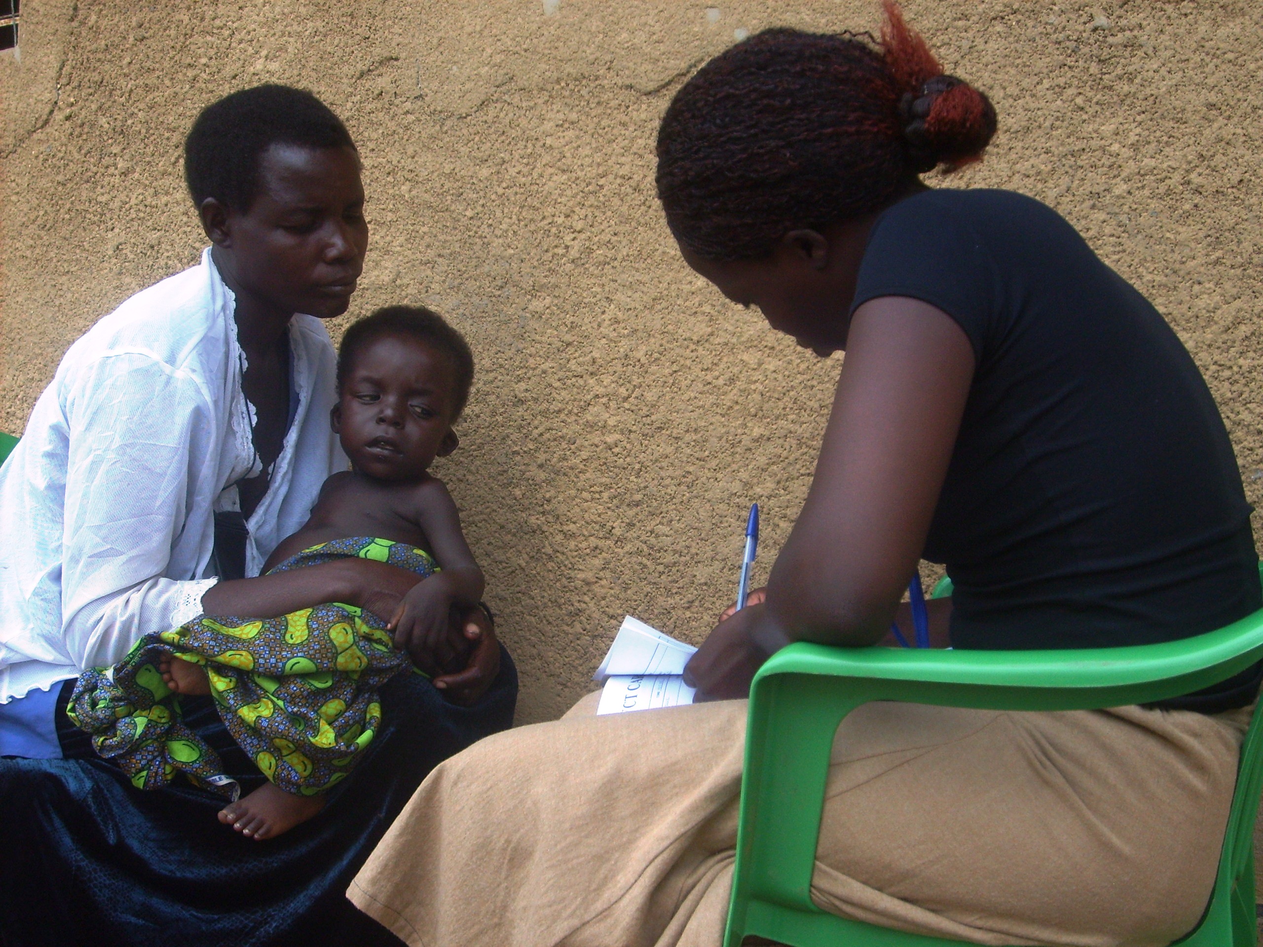 A mother receives home counselling before her HIV test in Alito sub-county, Apac District, Uganda