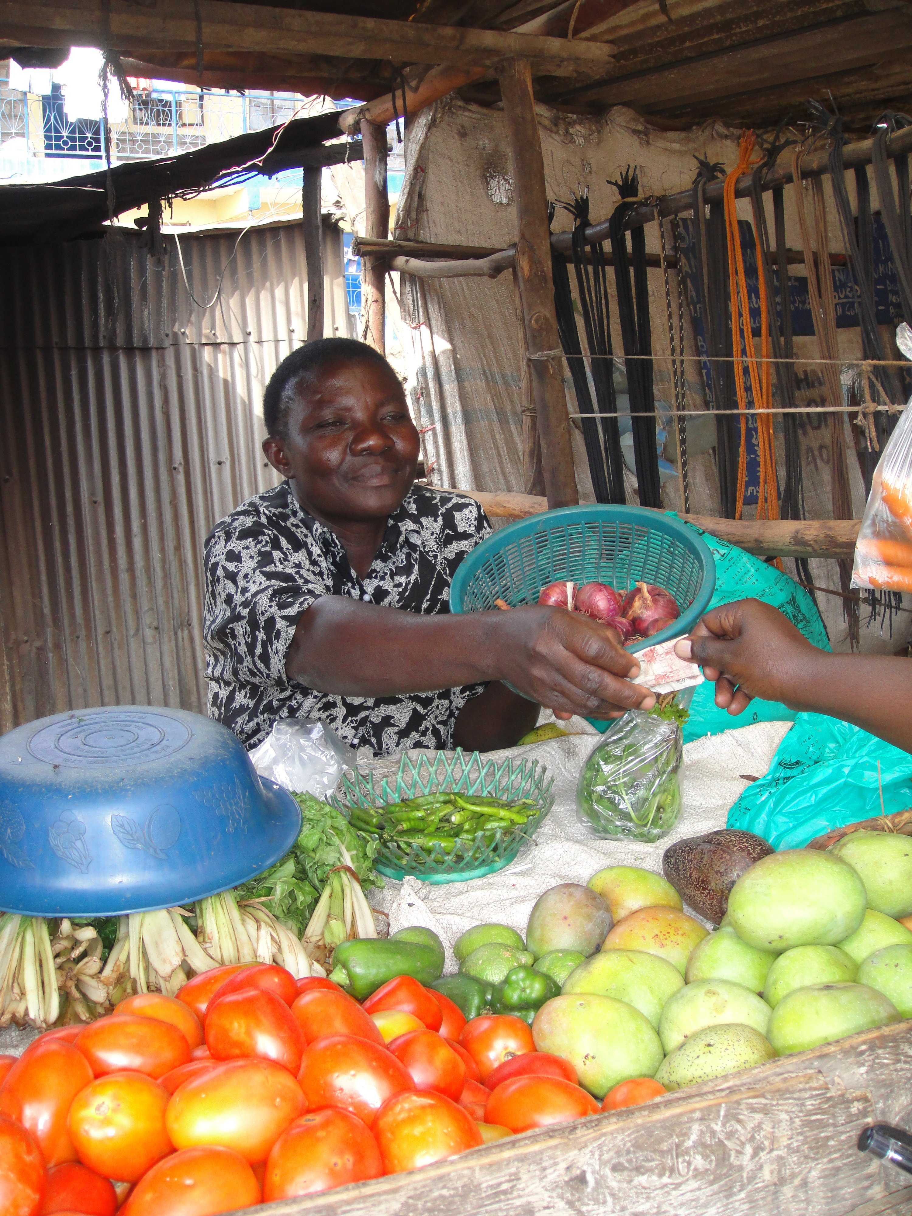 Fridah Awour Agolla at her vegetable stall in Mathare. She managed to put her children through primary school but never earned enough from the business to pay for secondary education Fridah Awour Agolla, selling her goods in Mathare