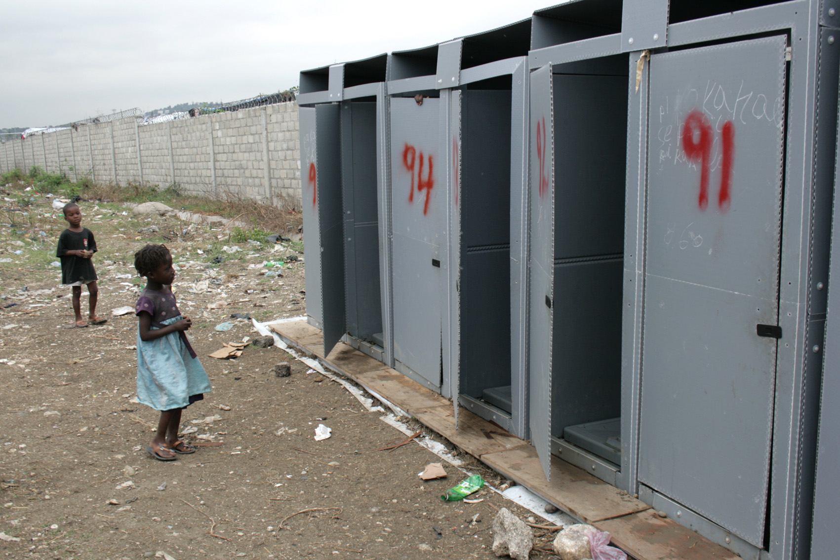 Latrines in a site for people displaced by the 12 January earthquake in Haiti. The lack of lighting and poor security of such sanitation facilities are exposing women and girls to a greater risk of rape and other forms of violence