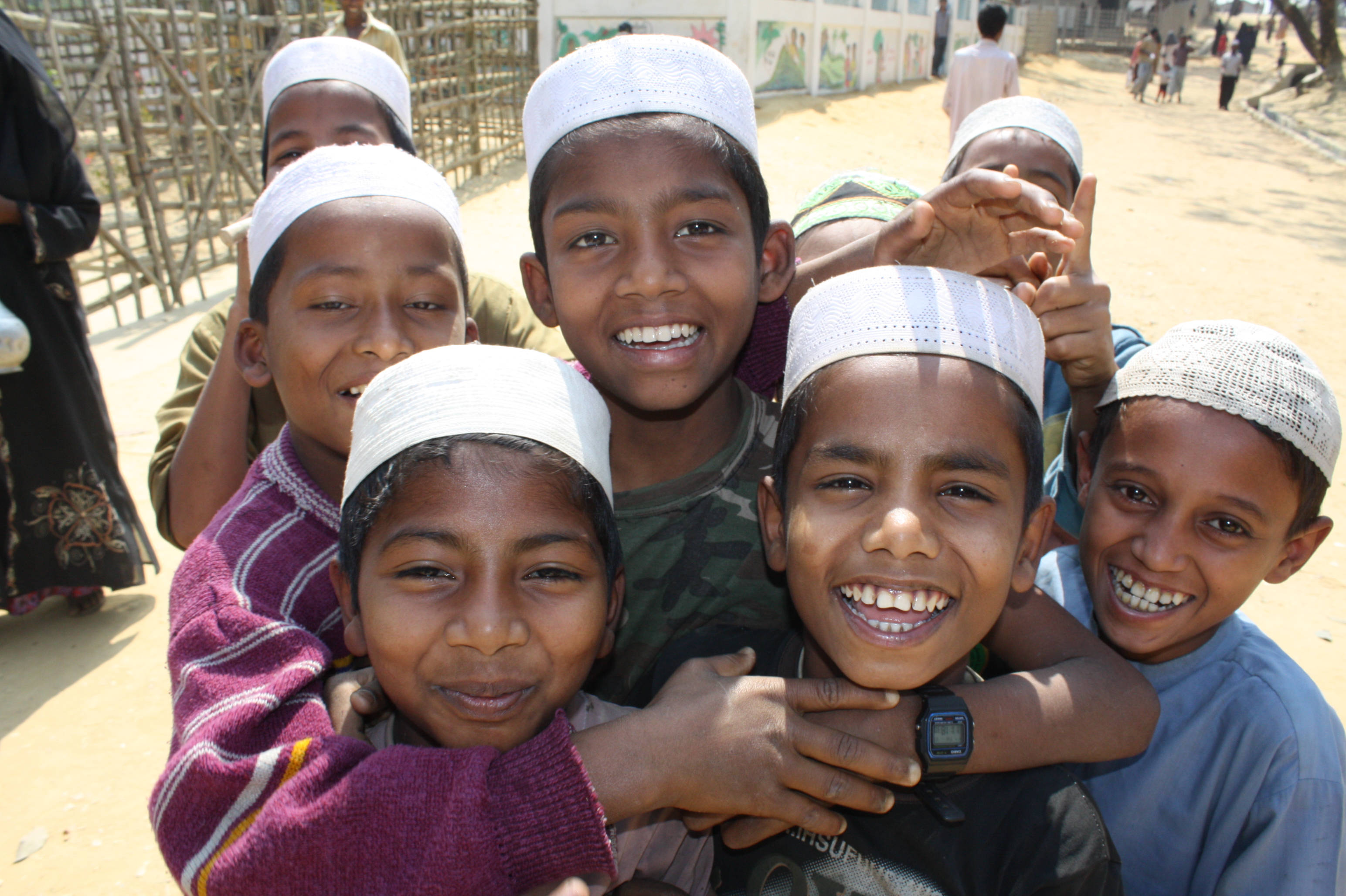 A group of boys smile to the camera at the  Kutupalong refugee camp outside Cox's Bazaar. There are 28,000 documented Rohingya refugees in Bangladesh