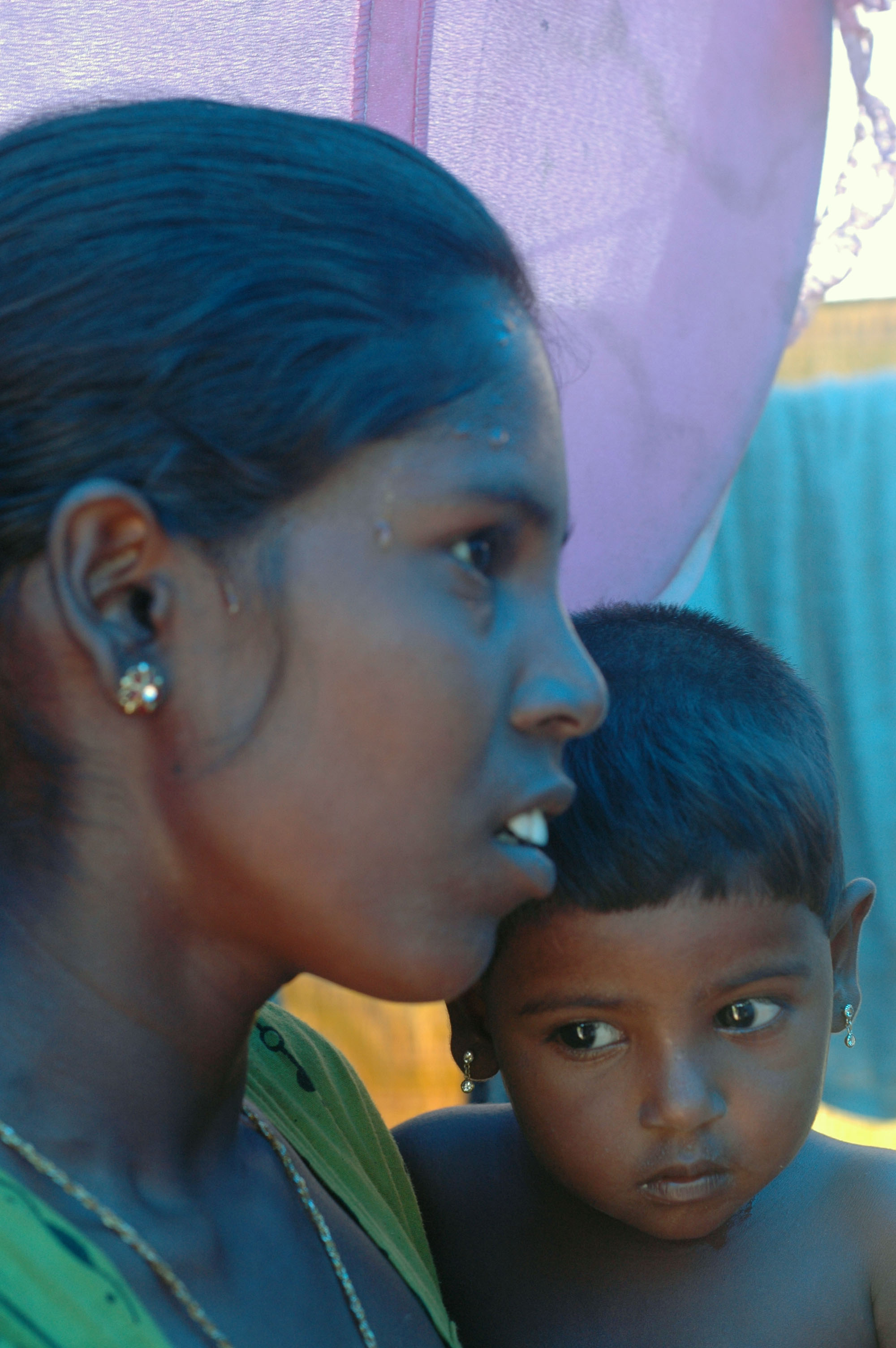 Nagaranjan Kallaiamuda, 22, outside her makeshift home in  Pulliyankulum in Mullaithivu District. Her family has just returned to their places of origin after months of displacement