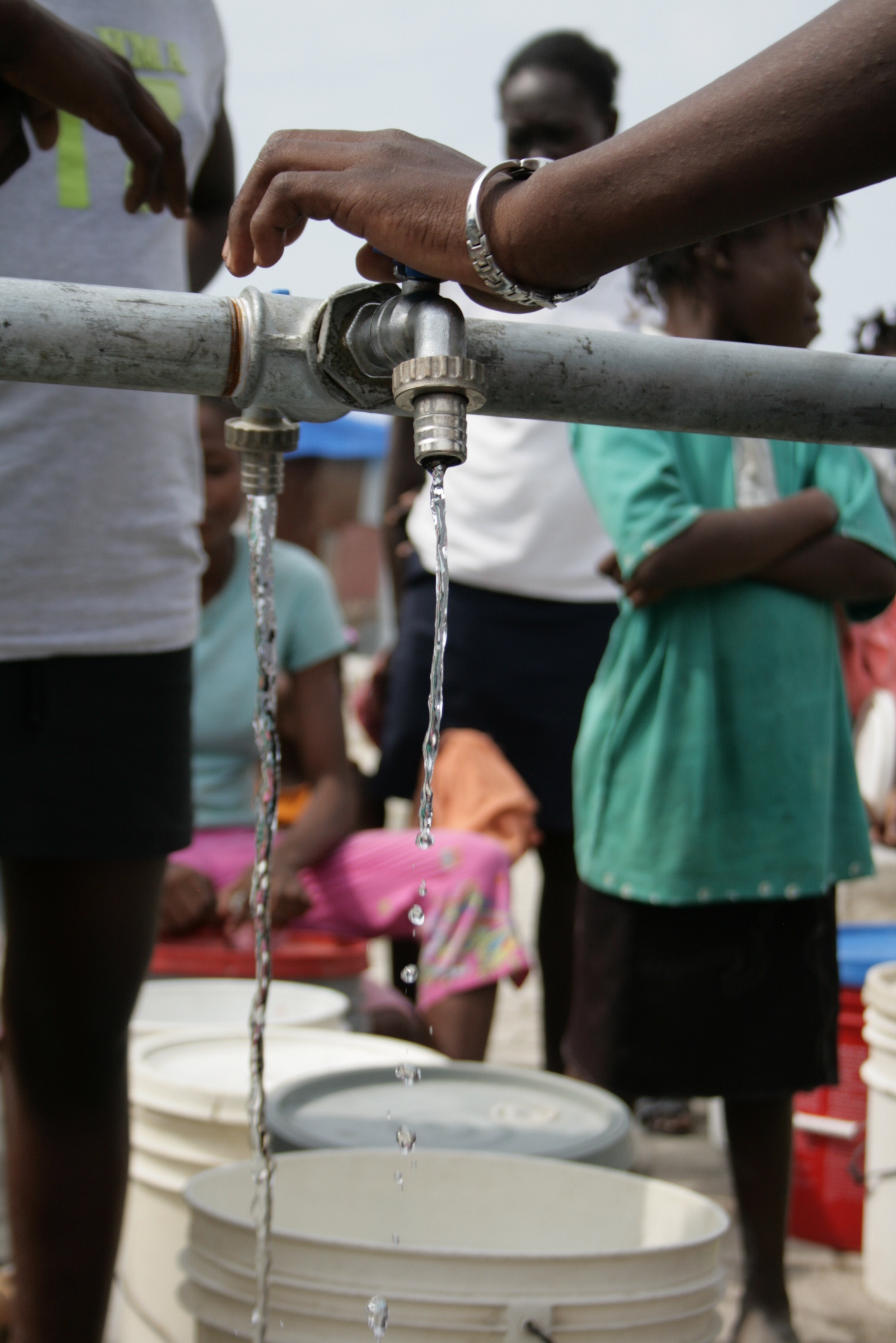 People at a water distribution site in the Port-au-Prince neighbourhood of Cité Soleil. March 2010