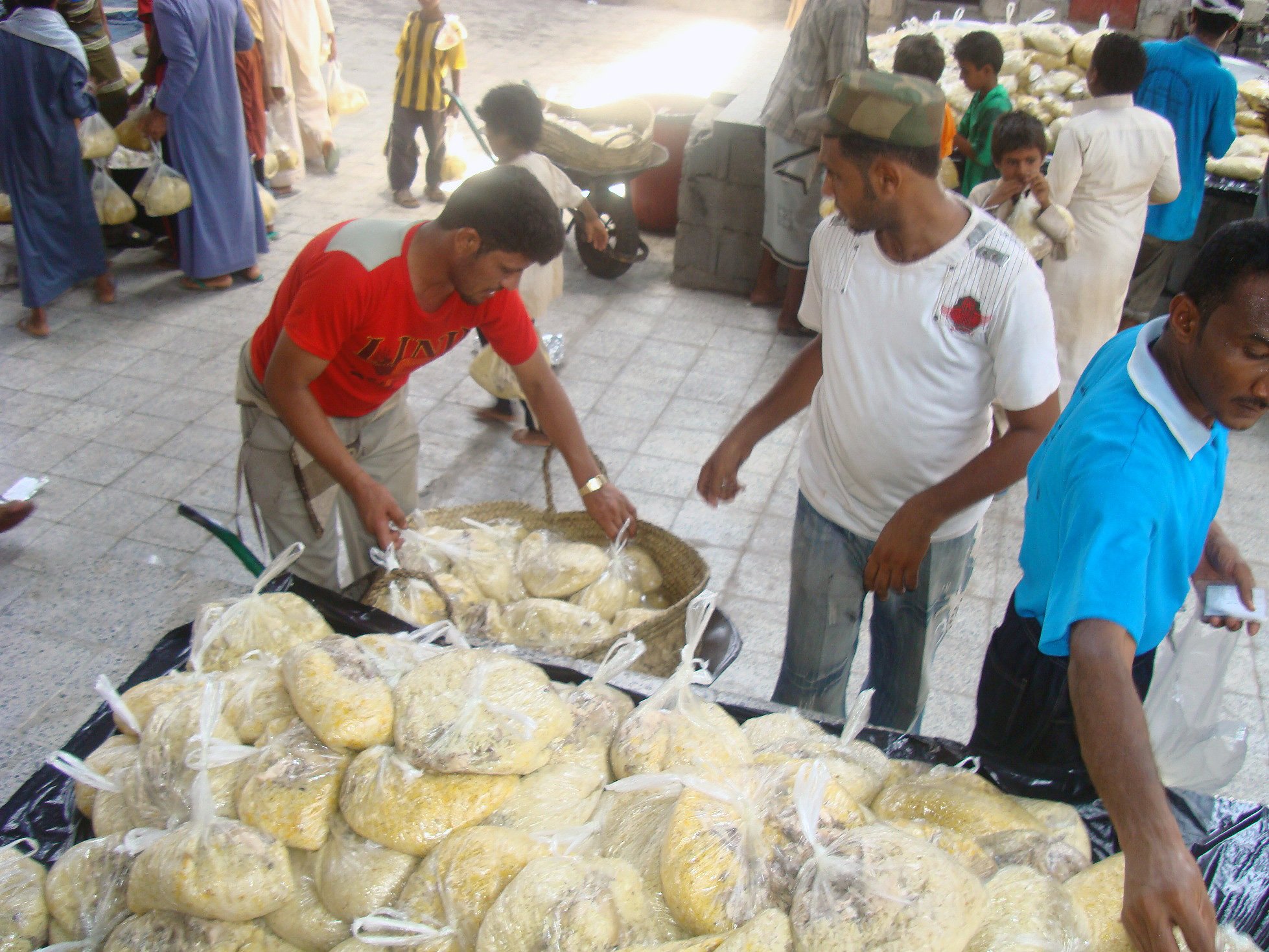 Cooks at the camp's central restaurant preparing lunch rations for IDPs