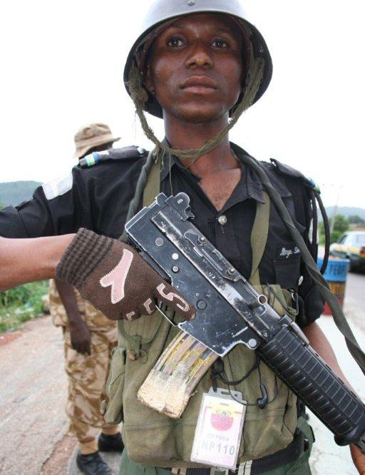 Member of the para-military Mobile Police, commonly known as "kill and go", at a roadblock in Jos - May 2010