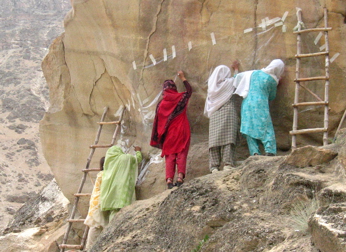 Women tracing ancient rock carvings in Pakistan | The New Humanitarian