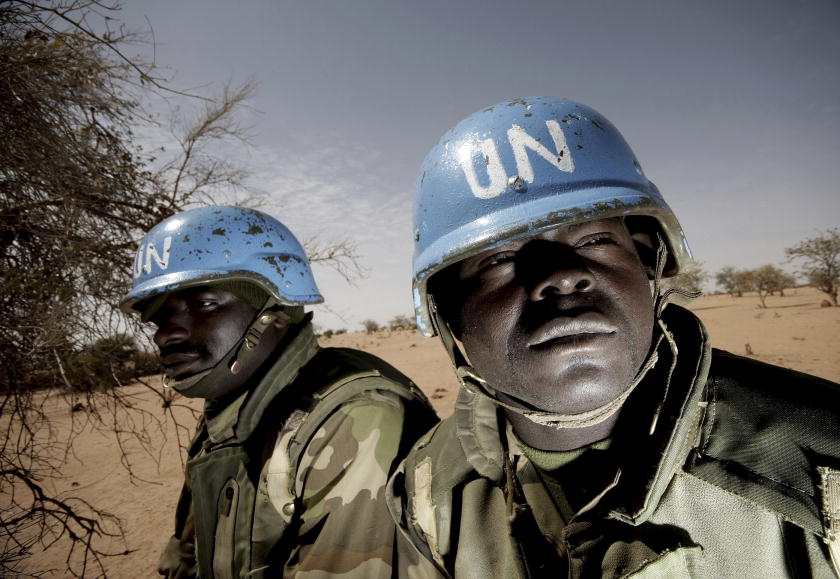 Members of the Nigerian battalion of the United Nations-African Union Hybrid Mission in Darfur (UNAMID) on patrol during a community meeting between UNAMID officials and Arab nomads