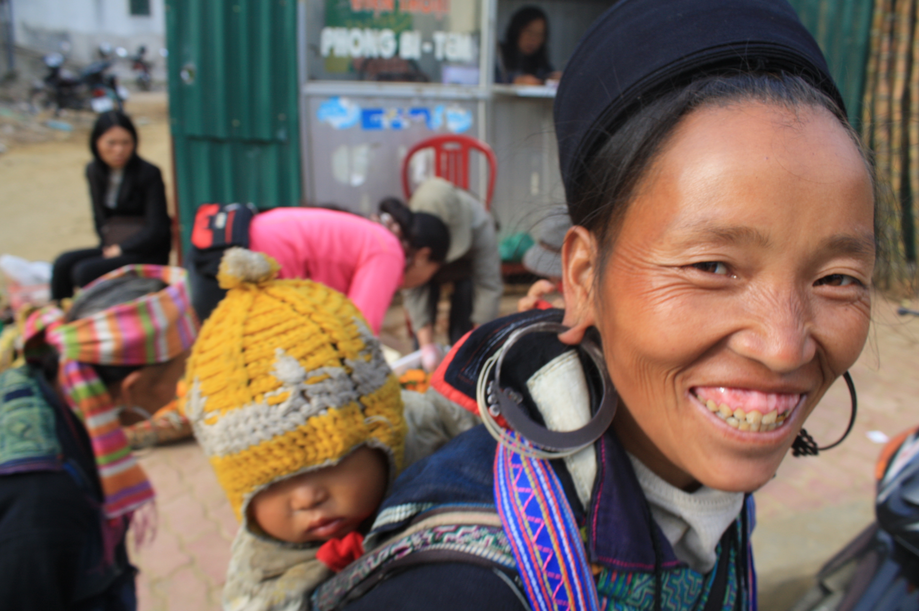 A Black H'mong woman and her child smile to the camera in Sapa, northwestern Vietnam. The French called these ethnic minorities Montagnards ('highlanders' or 'mountain people')