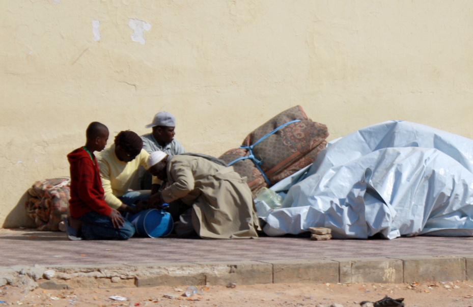 Migrant workers/refugees are sleeping by the roadside at Salloum
