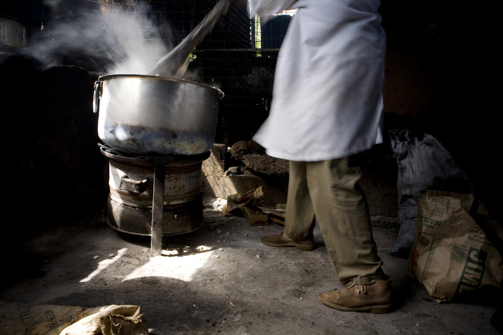 A cook on the job at a restaurant at the Nairobi City Park market, Kenya