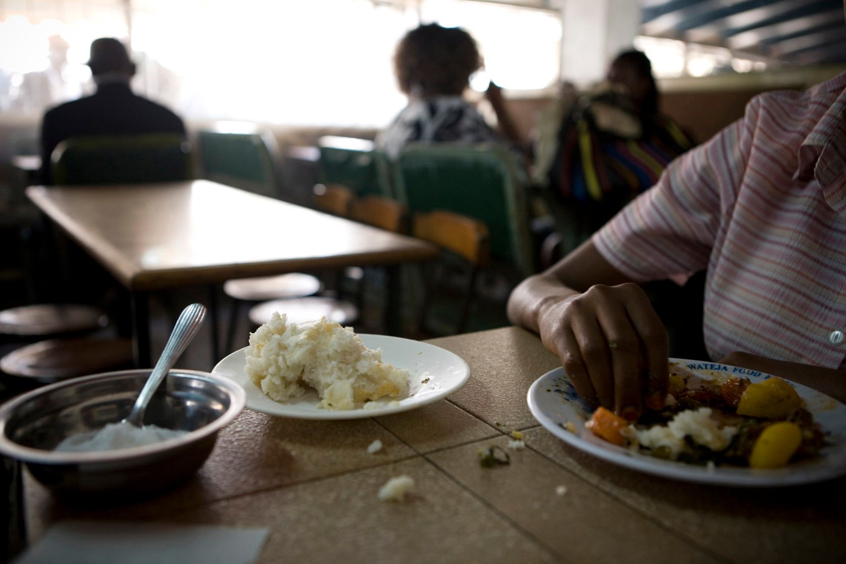 A customer having their lunch a a cafeteria in Nairobi, Kenya The New