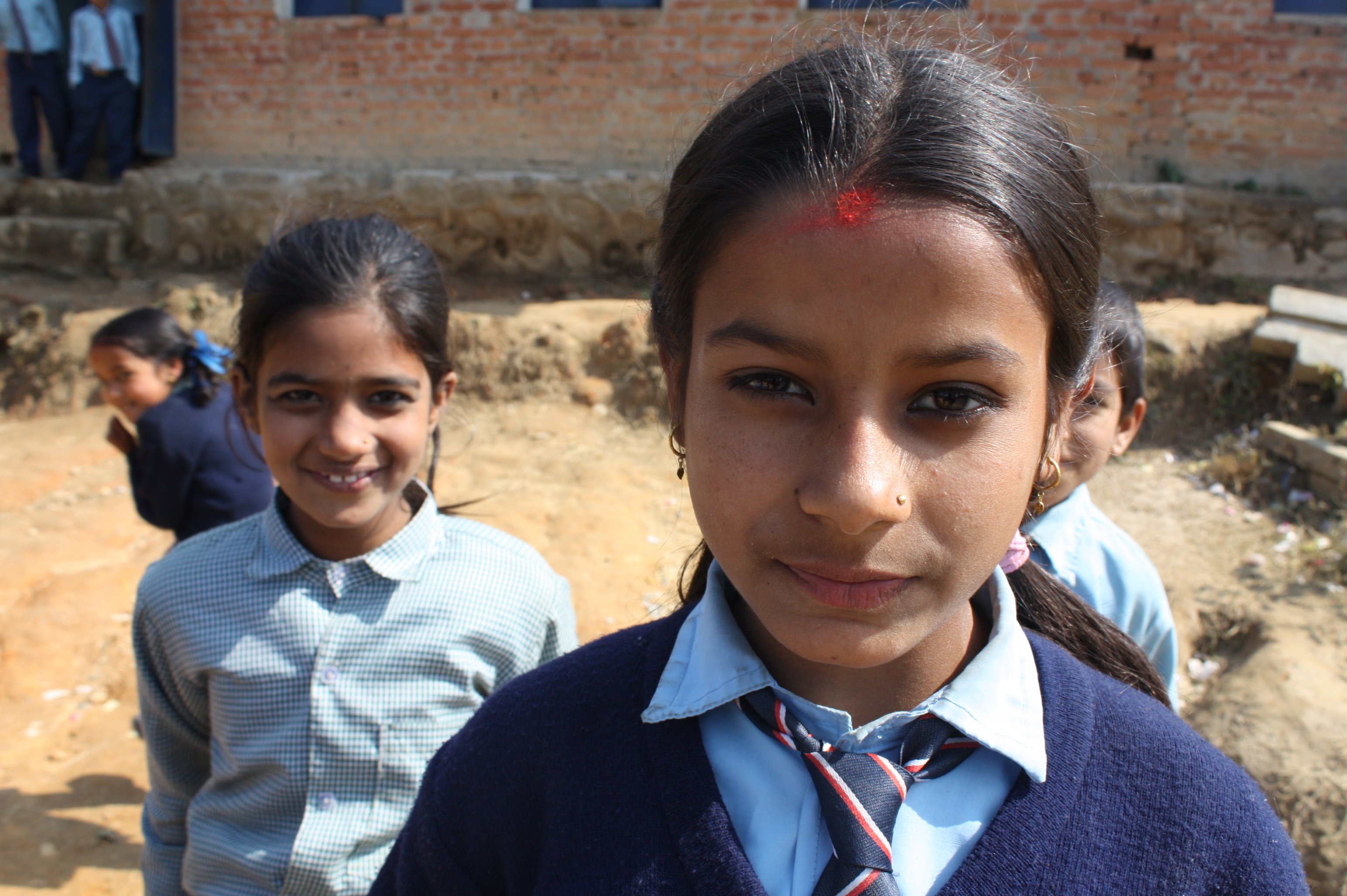 A young girl looks to the camera at the Panchakanya Secondary School in Nepal’s Bhaktapur District