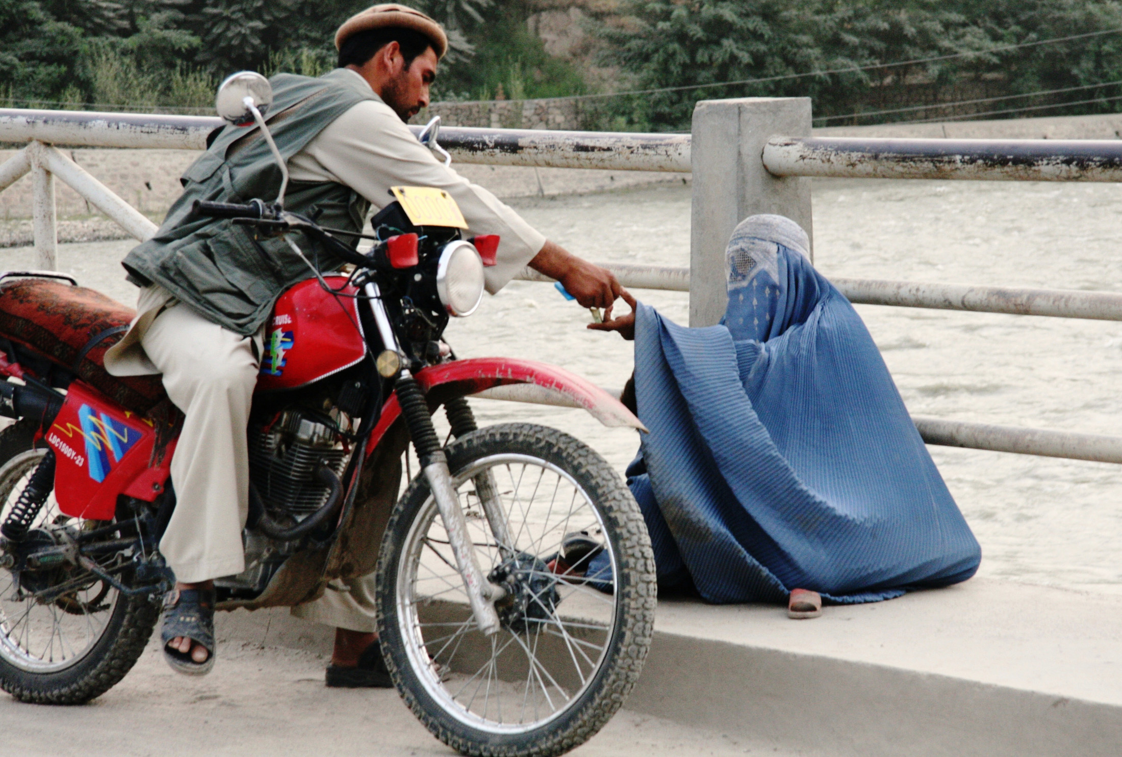 A woman begging in Faizabad, provincial capital of northeastern Badakhshan province. Poverty and unemployment are among the main causes of women and children trafficking in Afghanistan