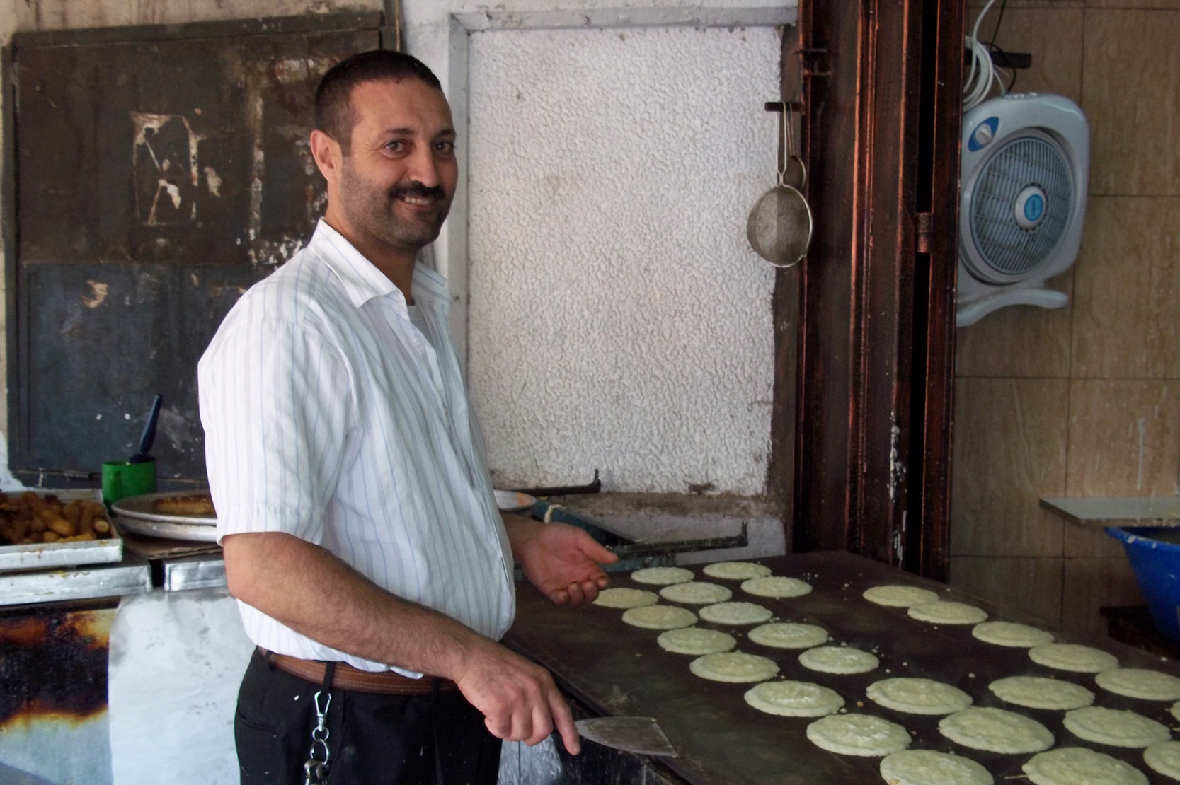 Ramallah baker preparing ‘katayef,’ a traditional pancake-like Ramadan sweet