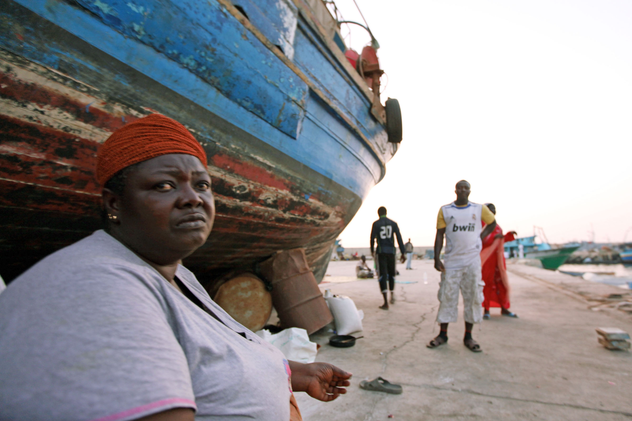 Since the Libyan uprising reached Tripoli, some 700 migrants from sub-Saharan Africa have sought refuge beneath the boats in Sidi Blal, an abandoned port just outside of Tripoli. They have little hope for positive change