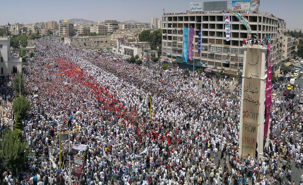 Syrian anti-regime protesters during a rally in al-Assy square in the western city of Hama