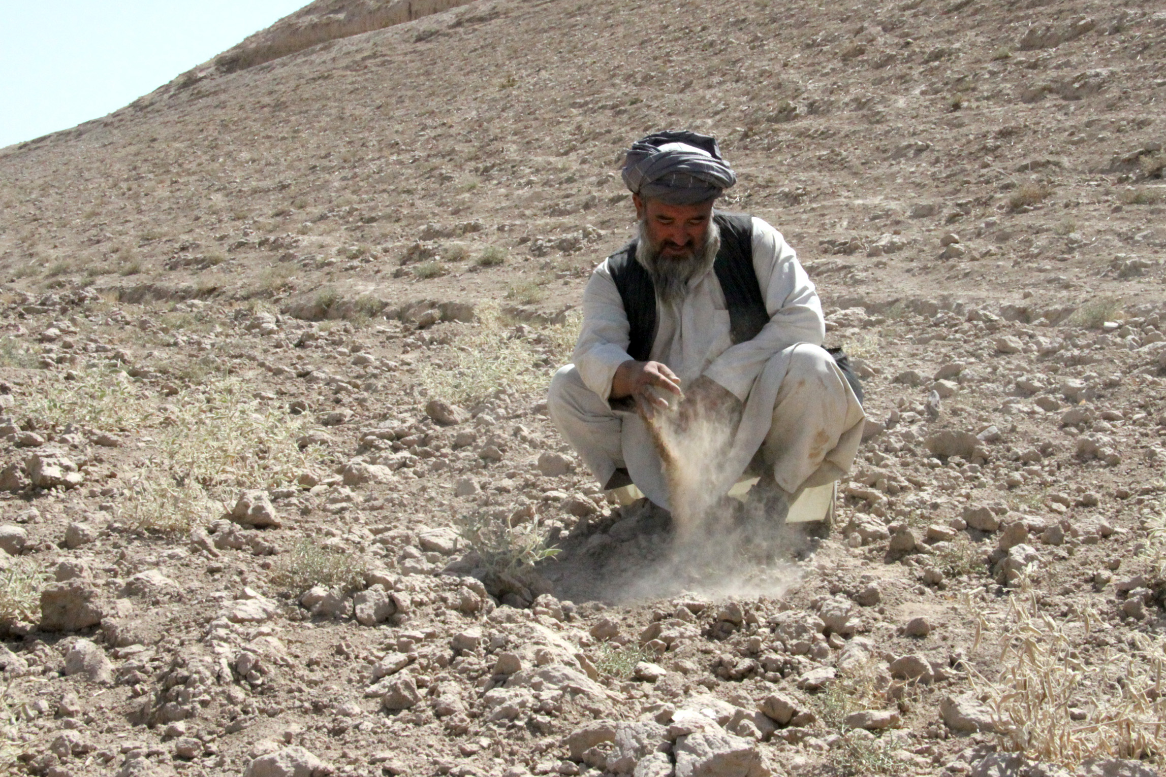 Mohammad Israyel on the hill on which his farm was located in Khuram Sar Bagh, Afghanistan