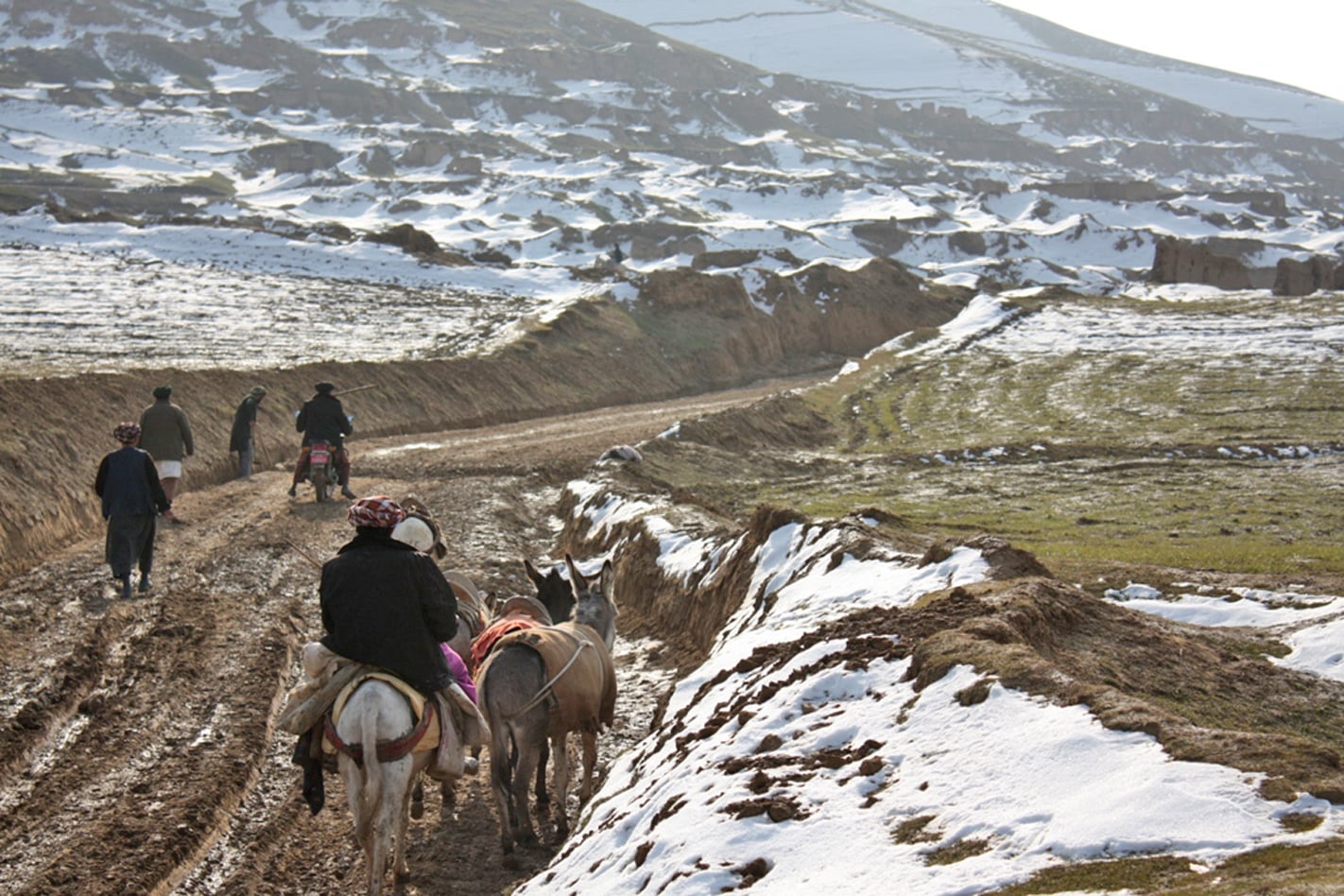 A new road in Pashtun Kot District in Afghanistan’s northern Faryab Province. Local villagers, who depend on rain for agriculture, welcome the snow after years of dry weather