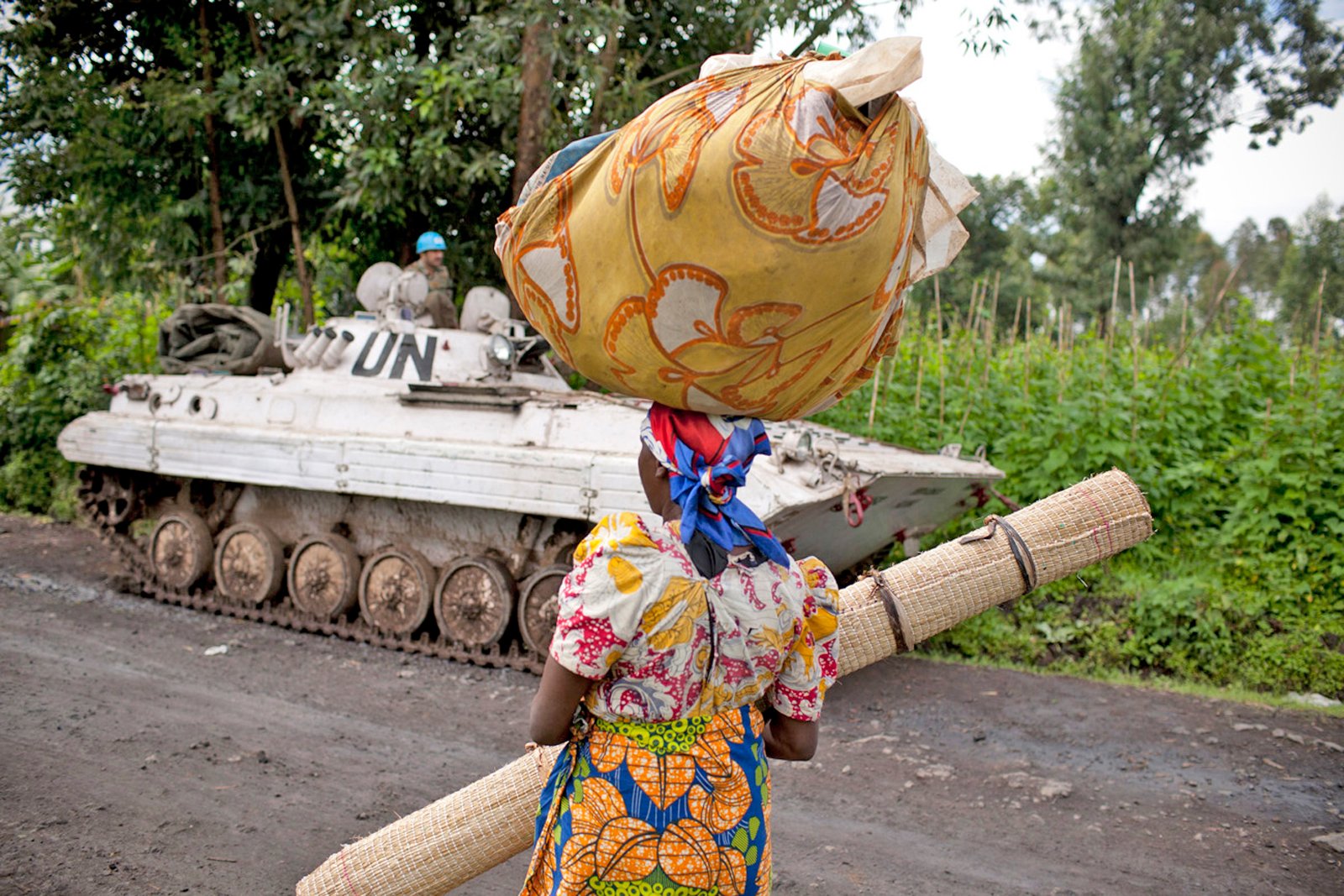 A Congolese woman walks past a UN peacekeepers’ base near Bunagana, eastern DRC (May 2012)