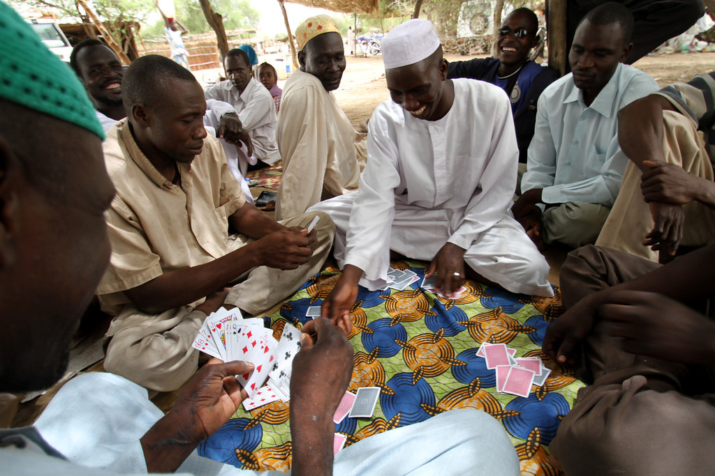 A friendly game of cards between Sudanese refugees in Goz Amir camp in Eastern Chad