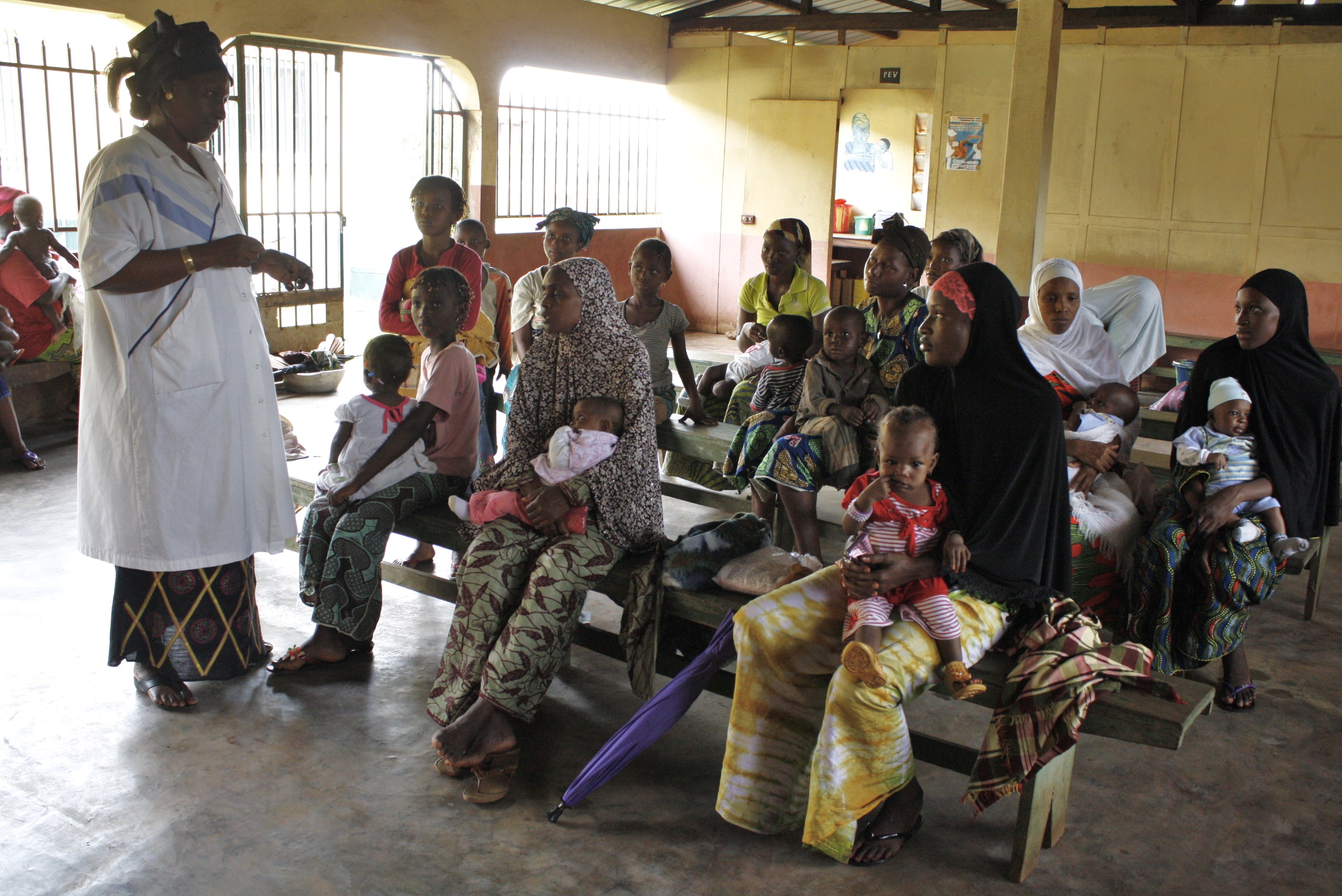 Women and their children at a community health centre in the Petit Simbaya neighbourhood of Guinea's capital Conakry