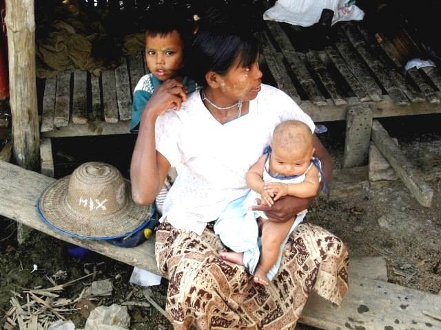 A mother and her two children in Myanmar's Ayeyarwady Delta 