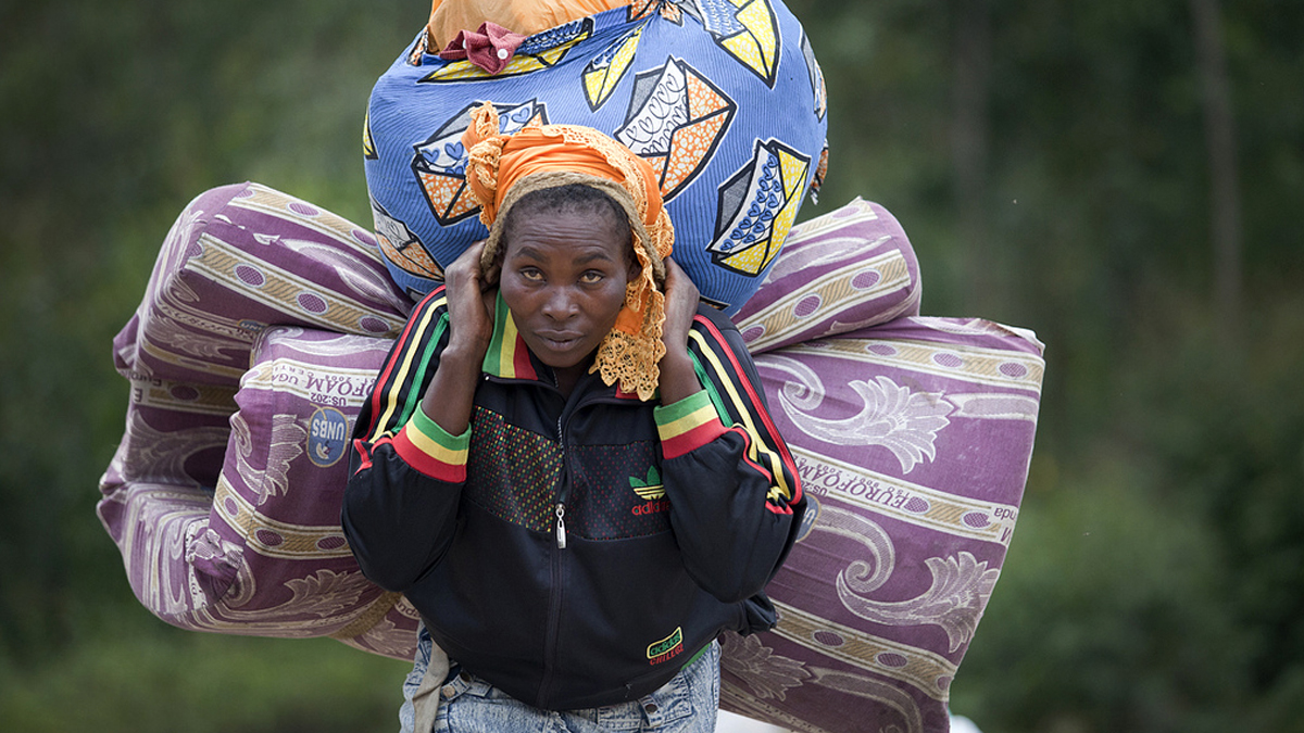 A woman IDP arrives in Munigi as Bosco Ntaganda fighter approach from goma, the 1st of March 2013