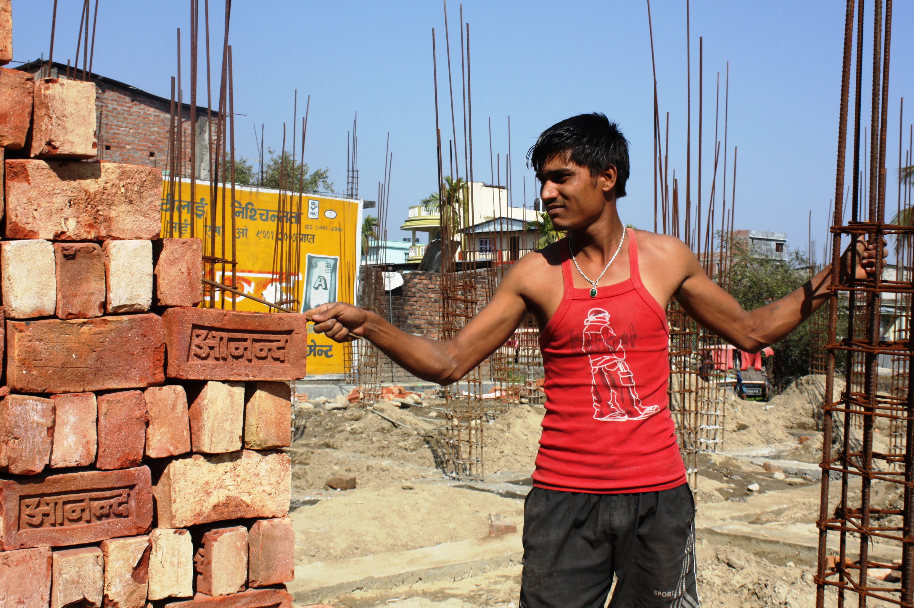 A mason working in the town of Damak, western Nepal. Training masons in how to build an earthquake-resistant home is a key challenge