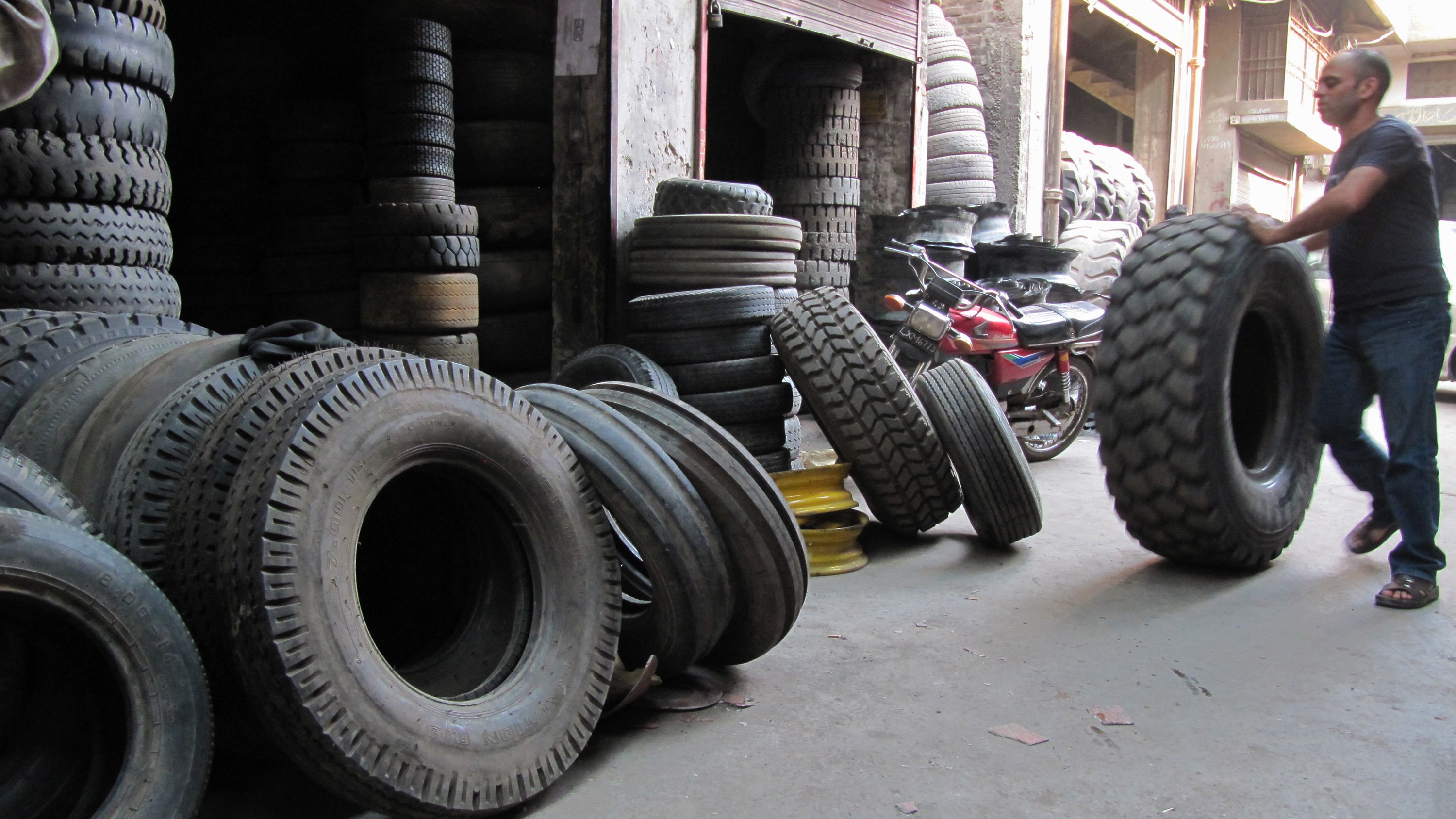 Police patrols in Lahore, Pakistan, fine those caught keeping car tyres on the street. Tyres holding puddles of water make an ideal breeding ground for mosquitoes carrying diseases like malaria and dengue fever. (May 2013)