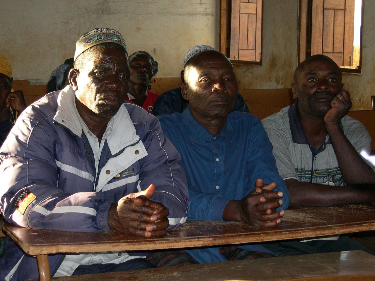 Local leaders at a recent meeting in Bandeze discuss the impact of a plantation project in the area