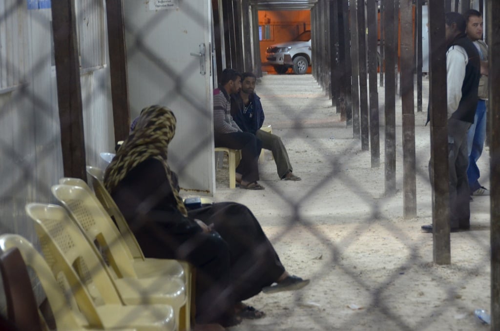 Syrian refugees wait to register at Za'atari camp in northern Jordan. The number of new arrivals has slowed in recent weeks (June 2013) 