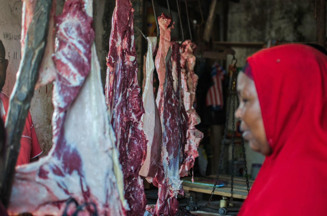 A Somali woman buys meat from a local butchery in Mogadishu (March 2013)