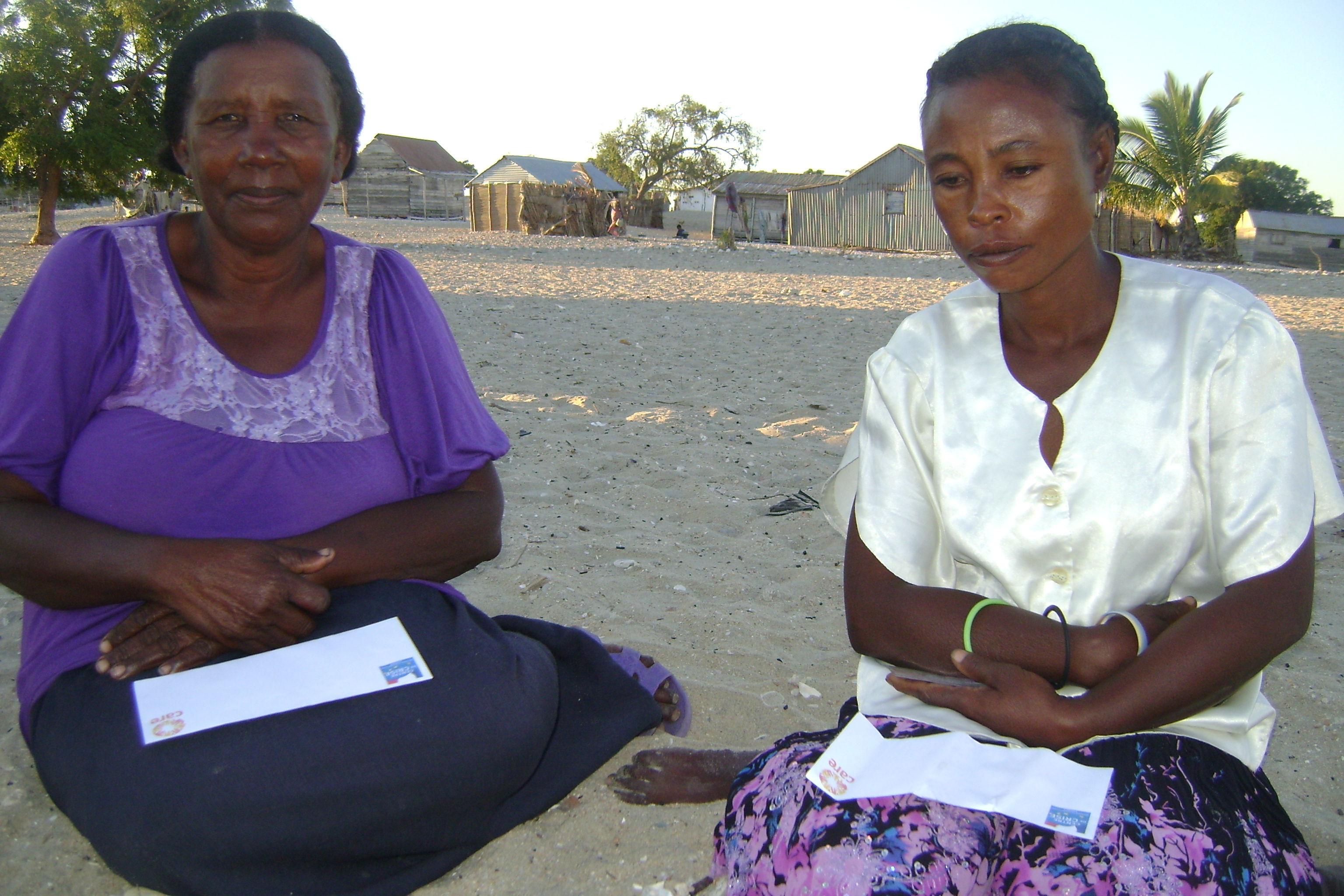 Widows Josiany Celestiny (right) and Vance Leonce received a cash donation from an aid agency to assist in rebuilding their livelihoods in the aftermath of Cyclone Haruna earlier this year