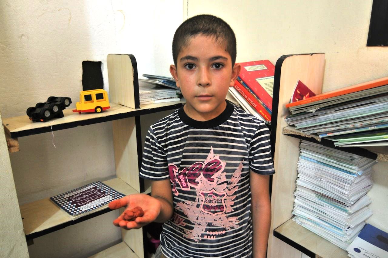 Ashraf, 8, left the Syrian city of Hama because government forces attacked rebels at the entrance to the town. He is now a refugee in Lebanon, where the NGO Najda Now has encouraged him to express himself through art. Here he uses playdough to make a worm