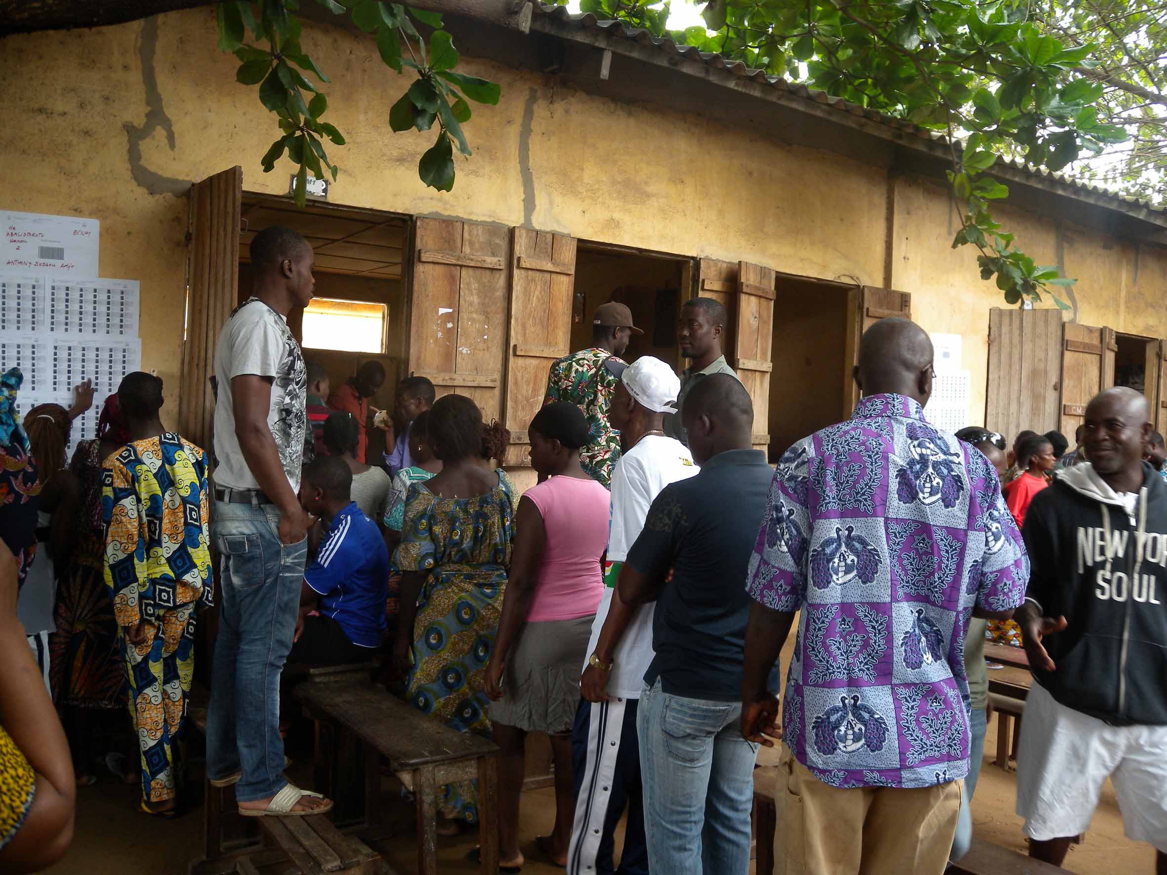 Voters in Togo queuing to cast ballots in parliamentary polls on 25 July 2013. Analysts said the ruling party's victory could stifle constitutional reforms