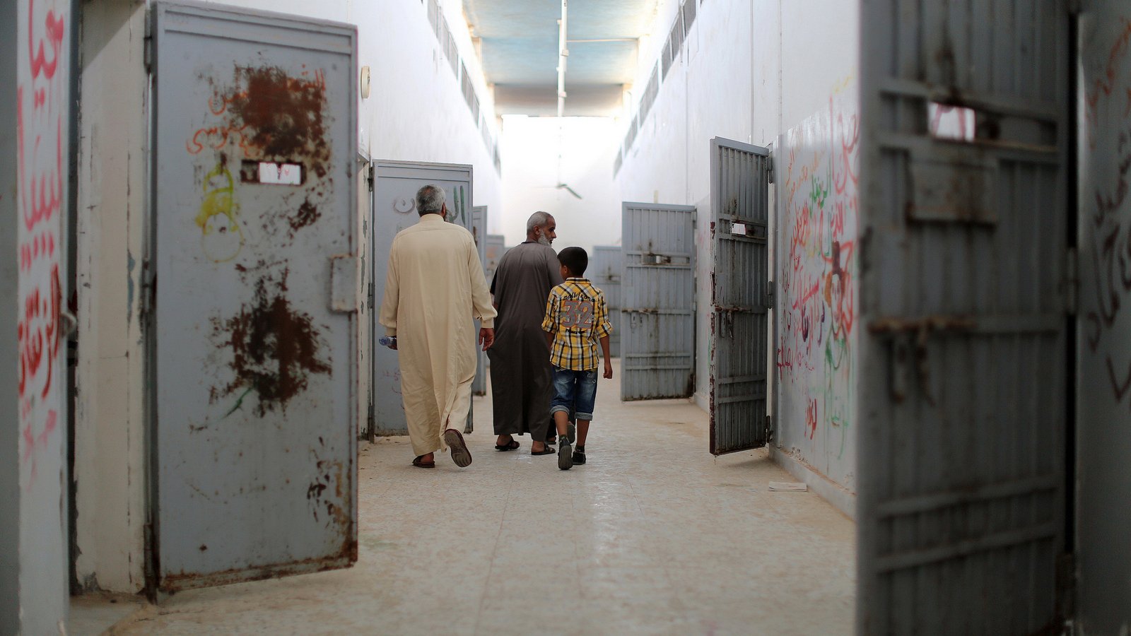 Visitors, including ex-prisoners and family members, roam through the cells of Libya's notorious jail, Abu Salim, during an exhibit marking the anniversary of a 1996 massacre of an estimated 1,200 inmates by their guards (file photo)