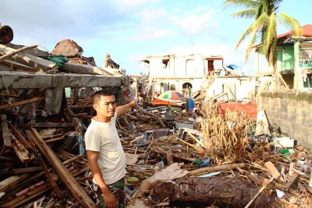 Eric Ponce, a resident of Tacloban city, which was badly affected by Typhoon Haiyan on 8 November, 2013. Millions were affected by the category 5 storm