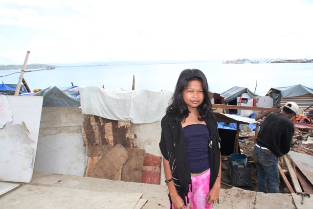 Lyka Manlunas, 12, a student and resident of Tacloban city, which was badly affected by Typhoon Haiyan on 8 November, 2013. Millions were affected by the category 5 storm