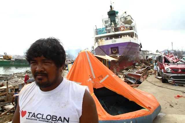 Charlie Cajeda, a resident of Tacloban city, which was badly affected by Typhoon Haiyan on 8 November, 2013. Millions were affected by the category 5 storm