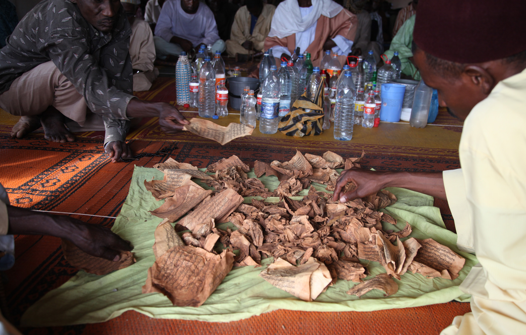 Men at Bossangoa’s mosque display pages ripped from Korans by Christian self defence groups that have exacted a deadly revenge on Muslims, as former rebels turned state forces comprising mainly
Muslims commit gross human rights violations on civilians.