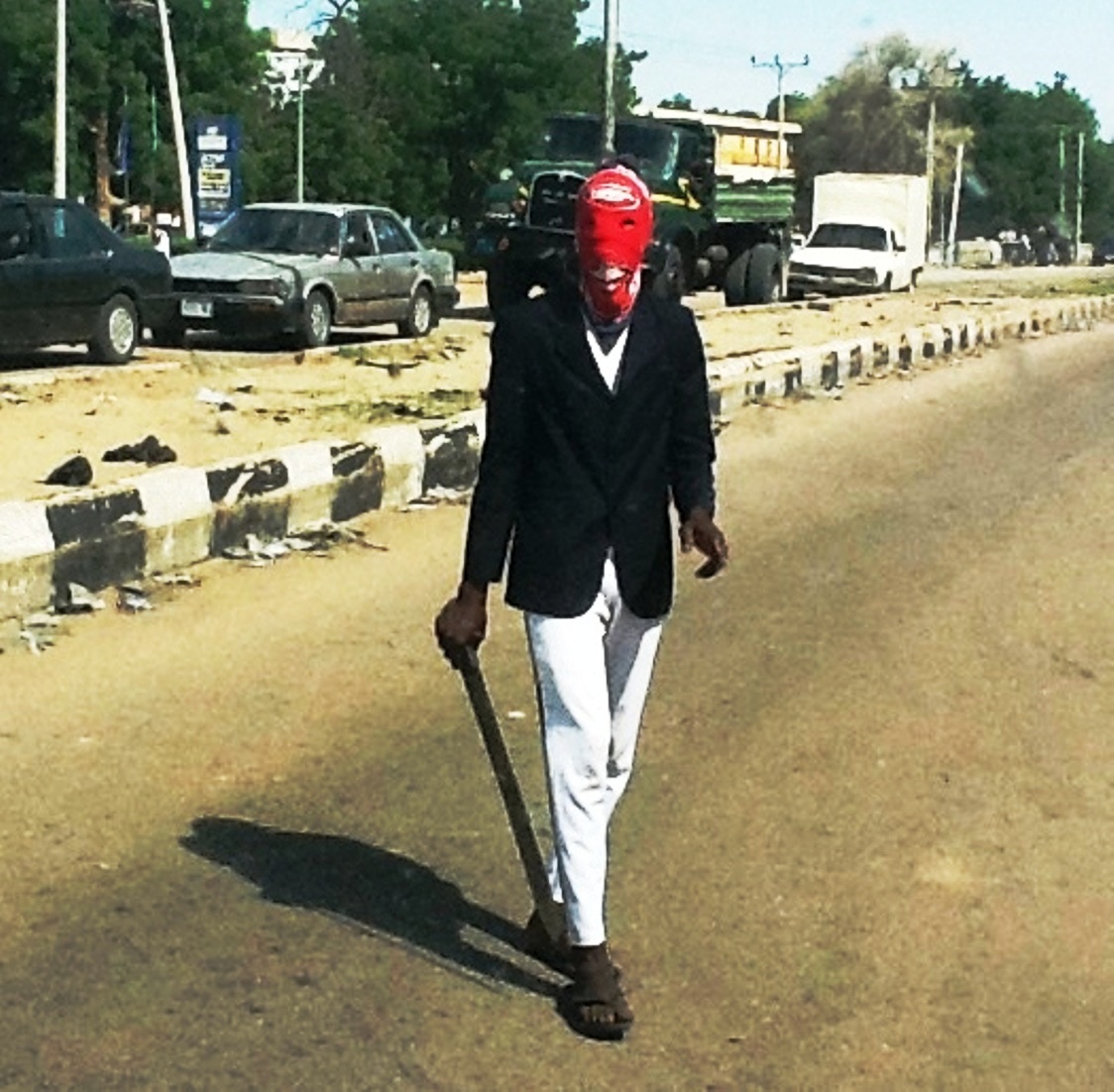 caption
A member of the civilian joint task force in Maiduguri, northeastern Nigeria. Civilians started forming vigilante groups in May to try to crack down on Boko Haram killings. Now the government has welcomed them as part of a more official effort to crack do