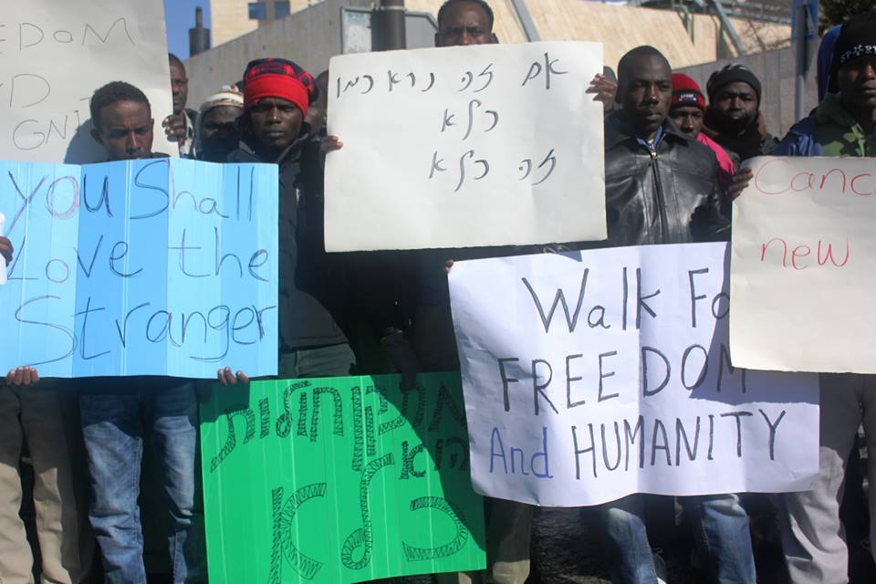 African migrants demonstrating near the Knesset in Jerusalem shortly before being arrested and returned to a new "open" holding facility in Israel's southern Negev desert 