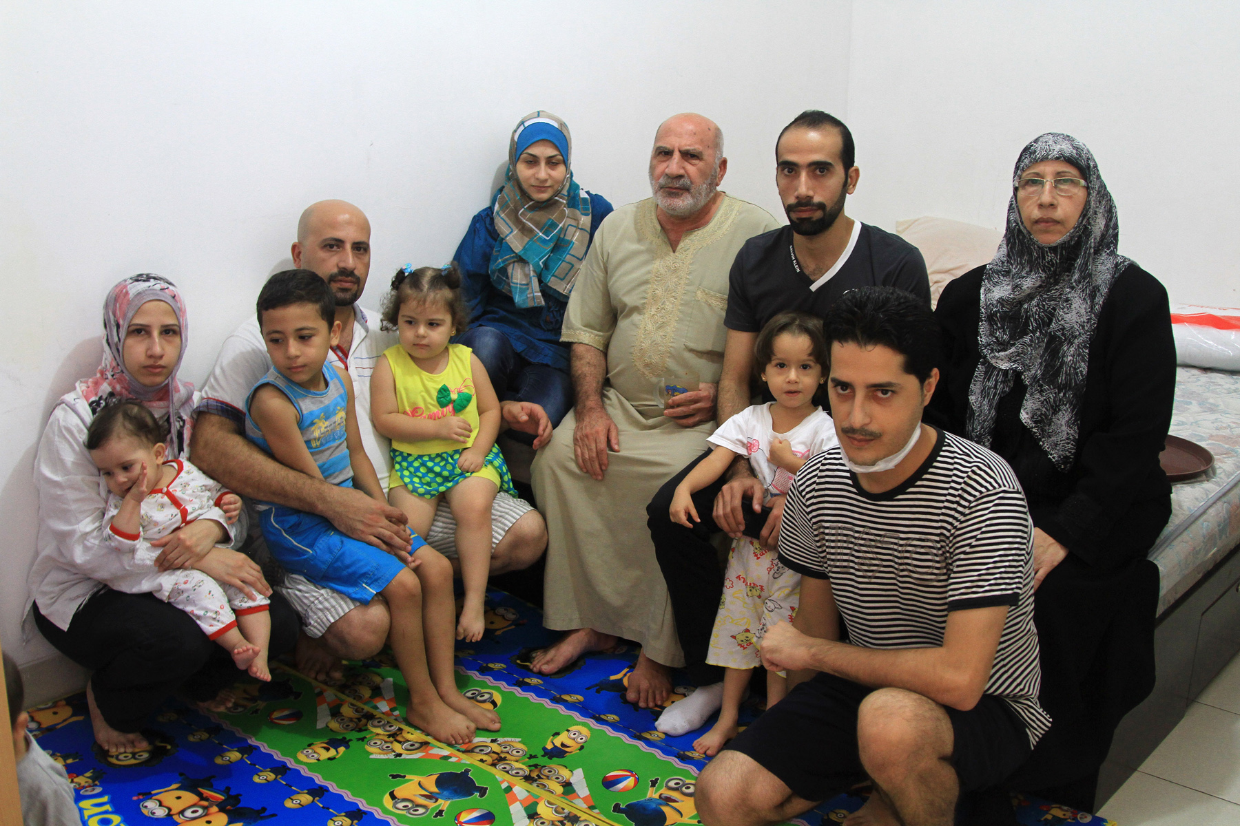 Hasan Kadad (pictured second from left) and his extended family arrived in Indonesia from Syria 21 months ago expecting a brief stay before joining family in Australia. After seven months in detention, they are now awaiting resettlement