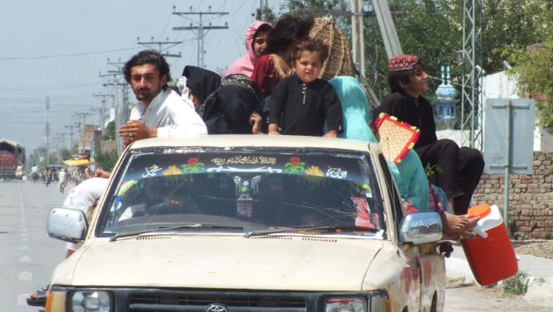 Families from North Waziristan traveling to Bannu. Pakistani security forces have setup checkpoints along the road.