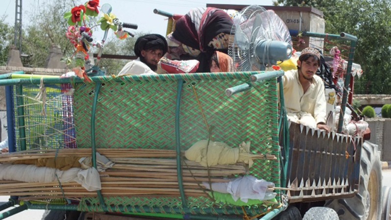 Families from North Waziristan traveling to Bannu. Pakistani security forces have setup checkpoints along the road.