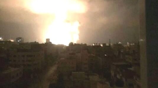 The view of bombing from a Gaza resident's window in July 2014 during Israel's attack on the Palestinian enclave. 